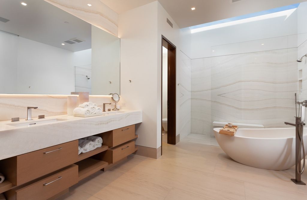 7 Strand Beach Drive in Dana Point, CA is an exquisite property that boasts breathtaking Pacific Ocean views, unparalleled contemporary architecture, and a prime location at The Strand at Headlands. Built in 2018 by Brown Brothers Construction, this modern custom showplace features approximately 9,630 square feet of living space, six ensuite bedrooms, and seven-and-a-half baths, including two primary suites and a junior suite on the top level.