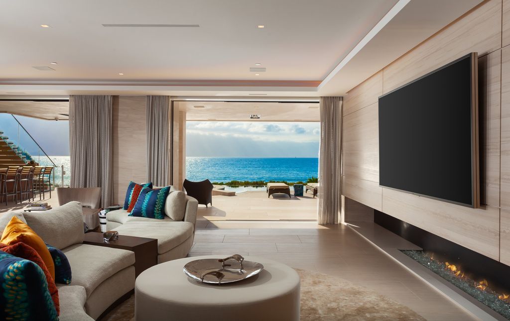 7 Strand Beach Drive in Dana Point, CA is an exquisite property that boasts breathtaking Pacific Ocean views, unparalleled contemporary architecture, and a prime location at The Strand at Headlands. Built in 2018 by Brown Brothers Construction, this modern custom showplace features approximately 9,630 square feet of living space, six ensuite bedrooms, and seven-and-a-half baths, including two primary suites and a junior suite on the top level.
