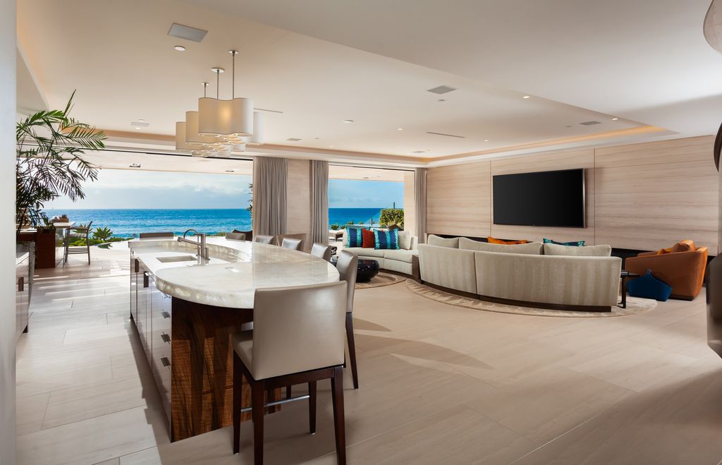 7 Strand Beach Drive in Dana Point, CA is an exquisite property that boasts breathtaking Pacific Ocean views, unparalleled contemporary architecture, and a prime location at The Strand at Headlands. Built in 2018 by Brown Brothers Construction, this modern custom showplace features approximately 9,630 square feet of living space, six ensuite bedrooms, and seven-and-a-half baths, including two primary suites and a junior suite on the top level.