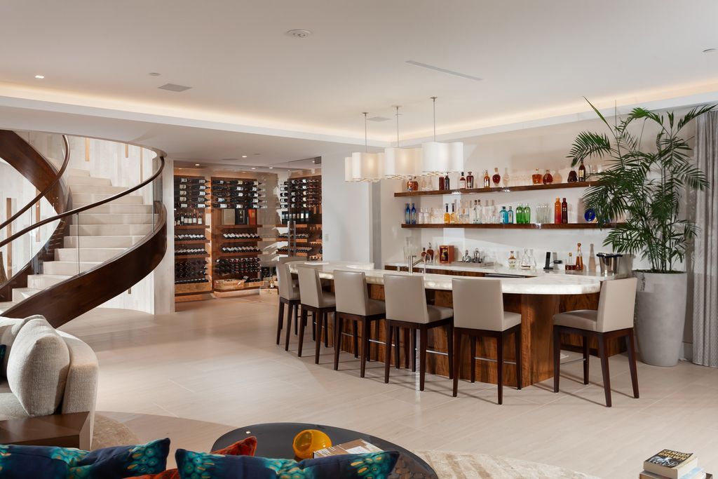 7 Strand Beach Drive in Dana Point, CA is an exquisite property that boasts breathtaking Pacific Ocean views, unparalleled contemporary architecture, and a prime location at The Strand at Headlands. Built in 2018 by Brown Brothers Construction, this modern custom showplace features approximately 9,630 square feet of living space, six ensuite bedrooms, and seven-and-a-half baths, including two primary suites and a junior suite on the top level.
