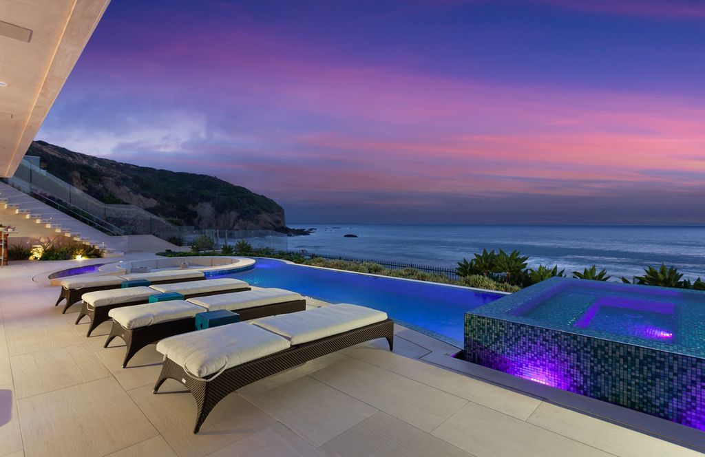 7 Strand Beach Drive in Dana Point, CA is an exquisite property that boasts breathtaking Pacific Ocean views, unparalleled contemporary architecture, and a prime location at The Strand at Headlands. Built in 2018 by Brown Brothers Construction, this modern custom showplace features approximately 9,630 square feet of living space, six ensuite bedrooms, and seven-and-a-half baths, including two primary suites and a junior suite on the top level.