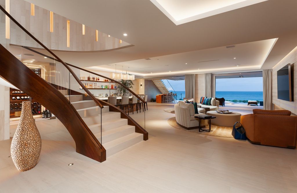 7 Strand Beach Drive in Dana Point, CA is an exquisite property that boasts breathtaking Pacific Ocean views, unparalleled contemporary architecture, and a prime location at The Strand at Headlands. Built in 2018 by Brown Brothers Construction, this modern custom showplace features approximately 9,630 square feet of living space, six ensuite bedrooms, and seven-and-a-half baths, including two primary suites and a junior suite on the top level.