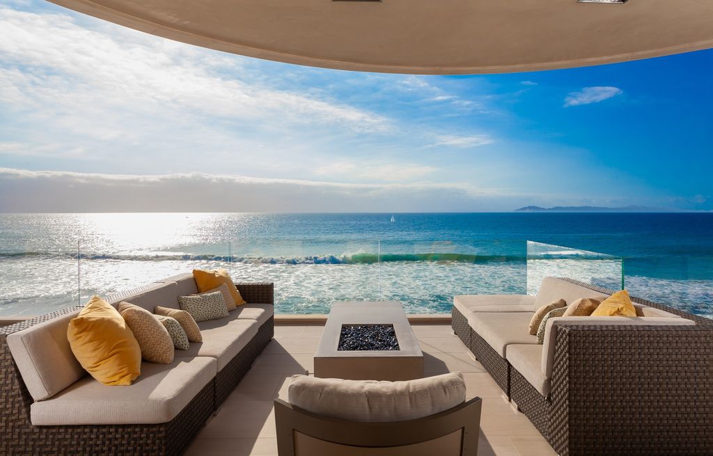 7 Strand Beach Drive in Dana Point, CA is an exquisite property that boasts breathtaking Pacific Ocean views, unparalleled contemporary architecture, and a prime location at The Strand at Headlands. Built in 2018 by Brown Brothers Construction, this modern custom showplace features approximately 9,630 square feet of living space, six ensuite bedrooms, and seven-and-a-half baths, including two primary suites and a junior suite on the top level.