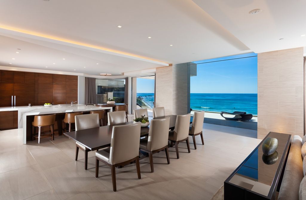 7 Strand Beach Drive in Dana Point, CA is an exquisite property that boasts breathtaking Pacific Ocean views, unparalleled contemporary architecture, and a prime location at The Strand at Headlands. Built in 2018 by Brown Brothers Construction, this modern custom showplace features approximately 9,630 square feet of living space, six ensuite bedrooms, and seven-and-a-half baths, including two primary suites and a junior suite on the top level.