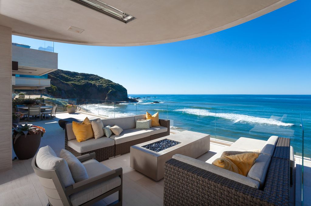 7 Strand Beach Drive in Dana Point, CA is an exquisite property that boasts breathtaking Pacific Ocean views, unparalleled contemporary architecture, and a prime location at The Strand at Headlands. Built in 2018 by Brown Brothers Construction, this modern custom showplace features approximately 9,630 square feet of living space, six ensuite bedrooms, and seven-and-a-half baths, including two primary suites and a junior suite on the top level.