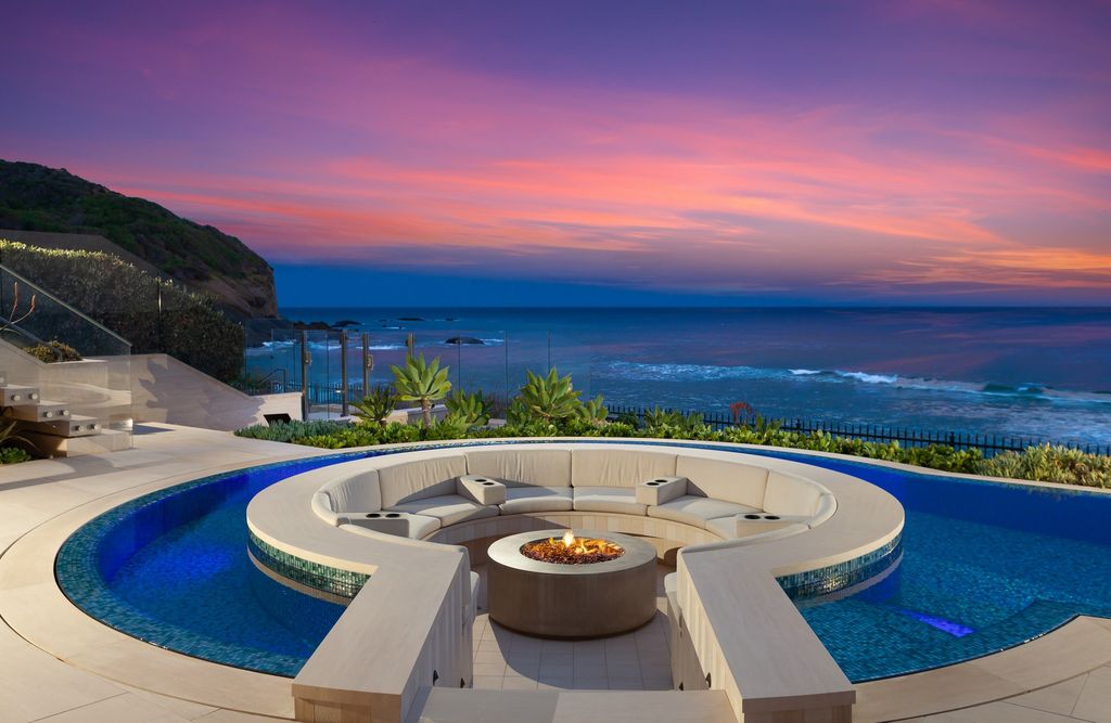 7 Strand Beach Drive in Dana Point, CA is an exquisite property that boasts breathtaking Pacific Ocean views, unparalleled contemporary architecture, and a prime location at The Strand at Headlands. Built in 2018 by Brown Brothers Construction, this modern custom showplace features approximately 9,630 square feet of living space, six ensuite bedrooms, and seven-and-a-half baths, including two primary suites and a junior suite on the top level.