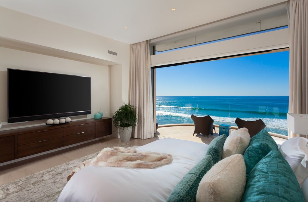 7 Strand Beach Drive in Dana Point, CA is an exquisite property that boasts breathtaking Pacific Ocean views, unparalleled contemporary architecture, and a prime location at The Strand at Headlands. Built in 2018 by Brown Brothers Construction, this modern custom showplace features approximately 9,630 square feet of living space, six ensuite bedrooms, and seven-and-a-half baths, including two primary suites and a junior suite on the top level.