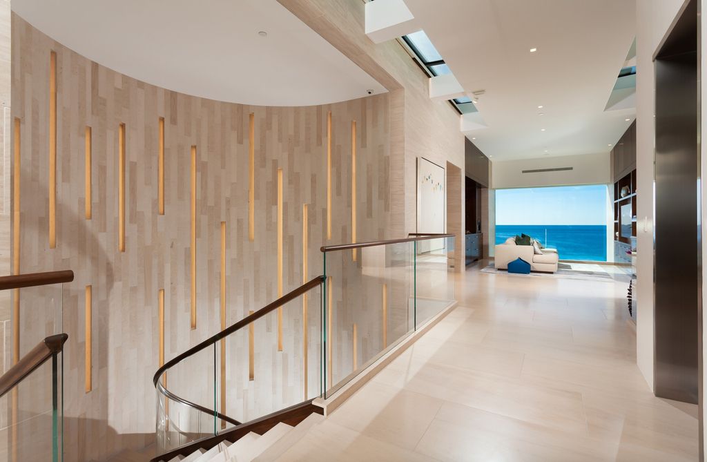 7 Strand Beach Drive in Dana Point, CA is an exquisite property that boasts breathtaking Pacific Ocean views, unparalleled contemporary architecture, and a prime location at The Strand at Headlands. Built in 2018 by Brown Brothers Construction, this modern custom showplace features approximately 9,630 square feet of living space, six ensuite bedrooms, and seven-and-a-half baths, including two primary suites and a junior suite on the top level.