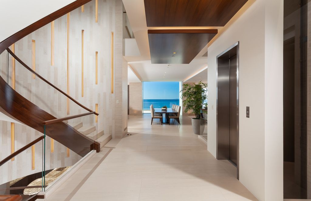 7 Strand Beach Drive in Dana Point, CA is an exquisite property that boasts breathtaking Pacific Ocean views, unparalleled contemporary architecture, and a prime location at The Strand at Headlands. Built in 2018 by Brown Brothers Construction, this modern custom showplace features approximately 9,630 square feet of living space, six ensuite bedrooms, and seven-and-a-half baths, including two primary suites and a junior suite on the top level.