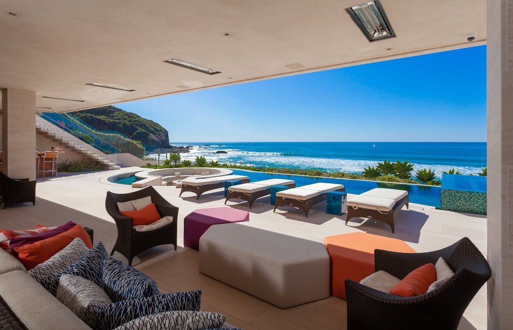 7 Strand Beach Drive in Dana Point, CA is an exquisite property that boasts breathtaking Pacific Ocean views, unparalleled contemporary architecture, and a prime location at The Strand at Headlands. Built in 2018 by Brown Brothers Construction, this modern custom showplace features approximately 9,630 square feet of living space, six ensuite bedrooms, and seven-and-a-half baths, including two primary suites and a junior suite on the top level.
