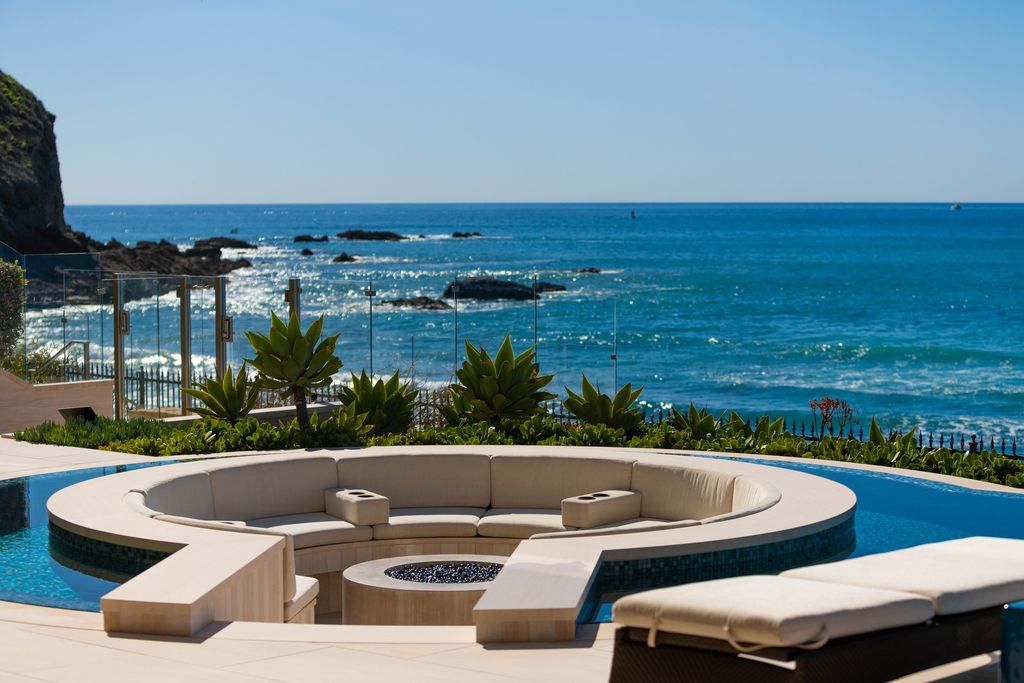 7 Strand Beach Drive in Dana Point, CA is an exquisite property that boasts breathtaking Pacific Ocean views, unparalleled contemporary architecture, and a prime location at The Strand at Headlands. Built in 2018 by Brown Brothers Construction, this modern custom showplace features approximately 9,630 square feet of living space, six ensuite bedrooms, and seven-and-a-half baths, including two primary suites and a junior suite on the top level.