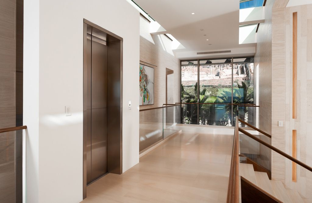 7 Strand Beach Drive in Dana Point, CA is an exquisite property that boasts breathtaking Pacific Ocean views, unparalleled contemporary architecture, and a prime location at The Strand at Headlands. Built in 2018 by Brown Brothers Construction, this modern custom showplace features approximately 9,630 square feet of living space, six ensuite bedrooms, and seven-and-a-half baths, including two primary suites and a junior suite on the top level.