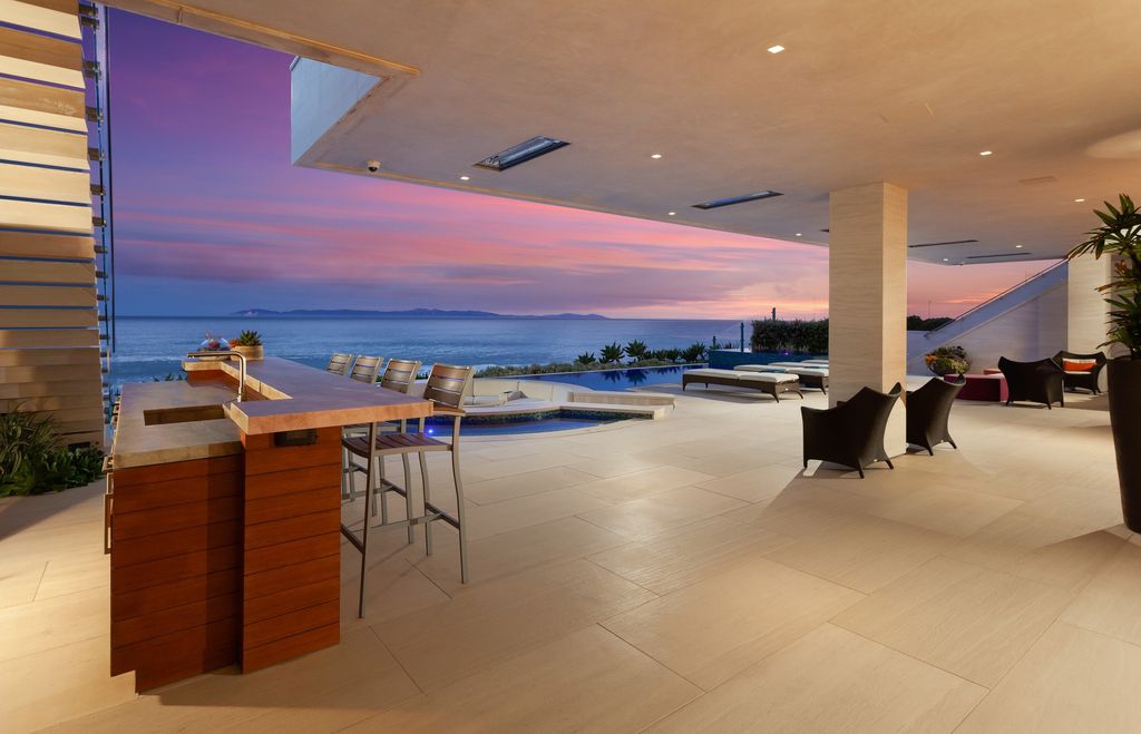 7 Strand Beach Drive in Dana Point, CA is an exquisite property that boasts breathtaking Pacific Ocean views, unparalleled contemporary architecture, and a prime location at The Strand at Headlands. Built in 2018 by Brown Brothers Construction, this modern custom showplace features approximately 9,630 square feet of living space, six ensuite bedrooms, and seven-and-a-half baths, including two primary suites and a junior suite on the top level.
