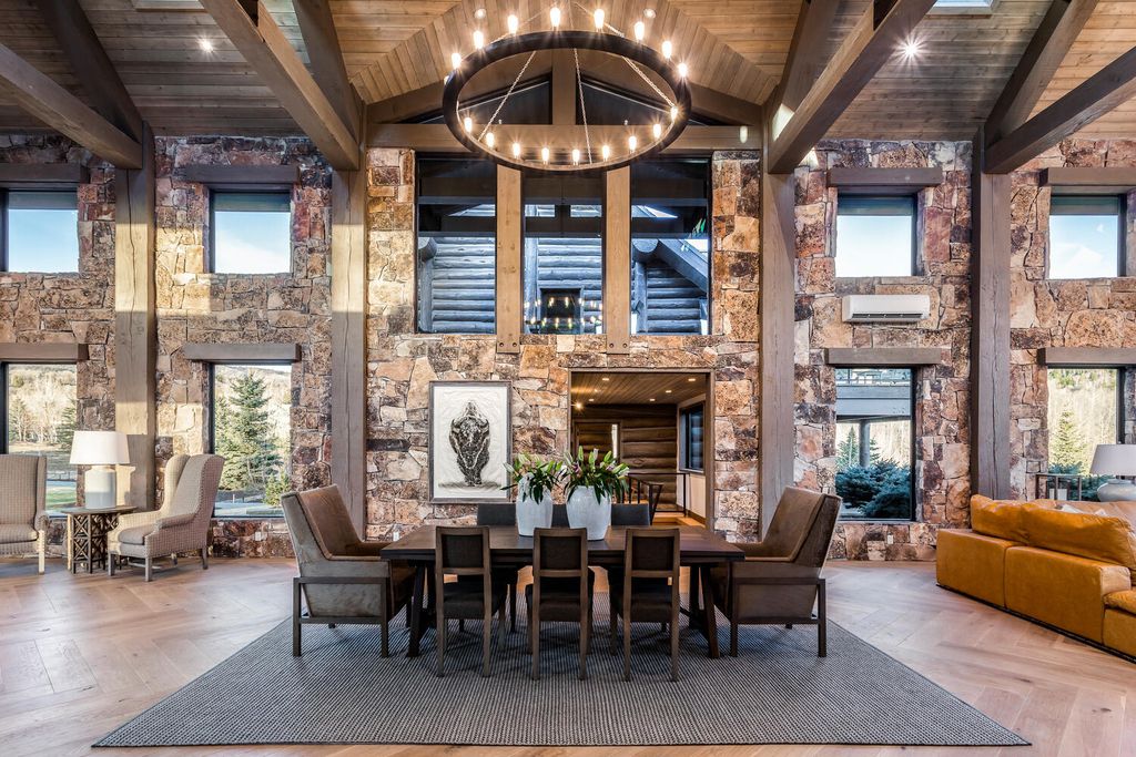 7600 E Deer Knoll Drive Home in Heber City, Utah. This custom-built home in Lashbrooke community offers a functional floor plan and ideal space for entertaining. With a main-level primary bedroom, gourmet kitchen, and great room opening to the keeping room, this home is perfect for hosting guests.