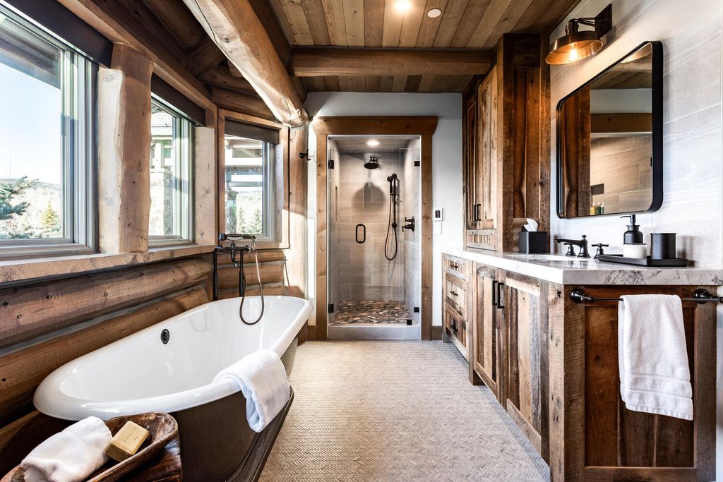 7600 E Deer Knoll Drive Home in Heber City, Utah. This custom-built home in Lashbrooke community offers a functional floor plan and ideal space for entertaining. With a main-level primary bedroom, gourmet kitchen, and great room opening to the keeping room, this home is perfect for hosting guests.