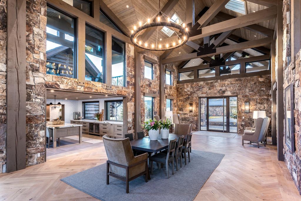 7600 E Deer Knoll Drive Home in Heber City, Utah. This custom-built home in Lashbrooke community offers a functional floor plan and ideal space for entertaining. With a main-level primary bedroom, gourmet kitchen, and great room opening to the keeping room, this home is perfect for hosting guests.