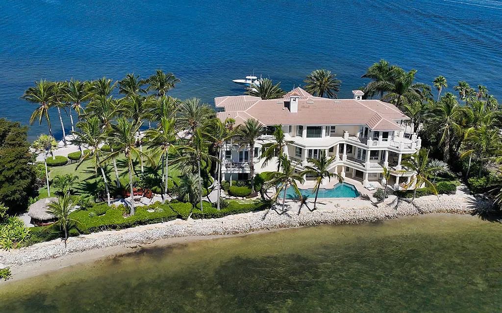 Welcome to a stunning Siesta Key coastal home 1414 Point Crisp Road, Sarasota, Florida with 360-degree bay views and 546 feet of waterfront on Little Sarasota Bay. This 6-bed, 9-bath home boasts 7,162 sqft of living space on 1.22 acres of land.