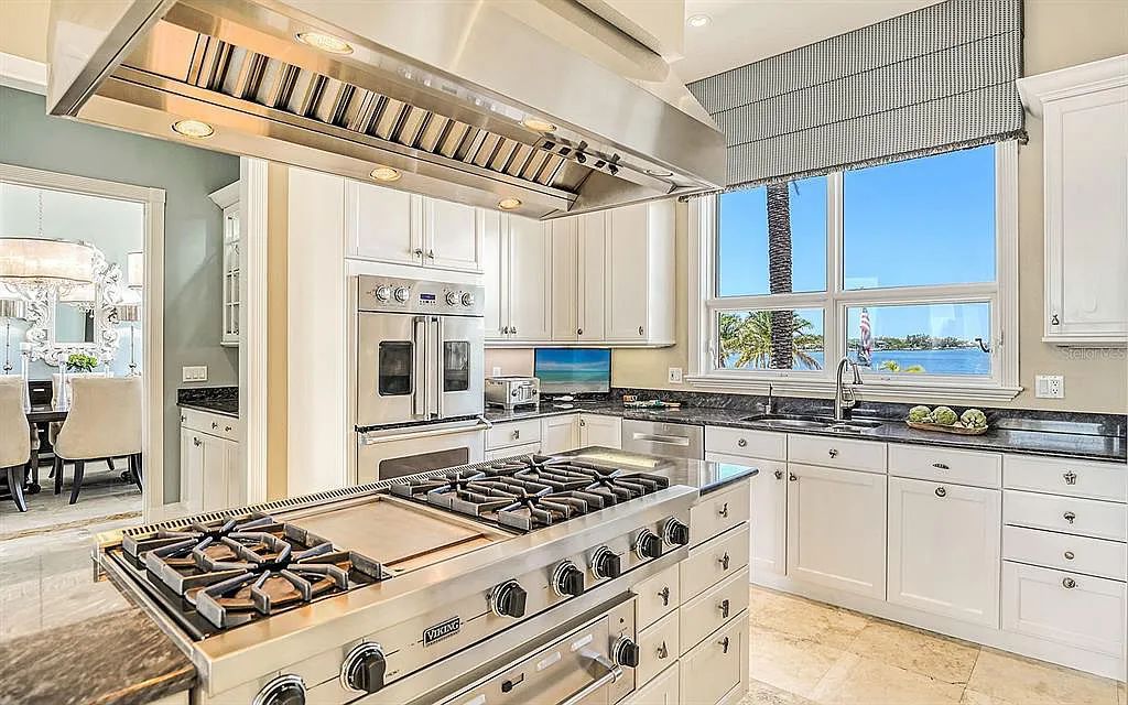 Welcome to a stunning Siesta Key coastal home 1414 Point Crisp Road, Sarasota, Florida with 360-degree bay views and 546 feet of waterfront on Little Sarasota Bay. This 6-bed, 9-bath home boasts 7,162 sqft of living space on 1.22 acres of land.