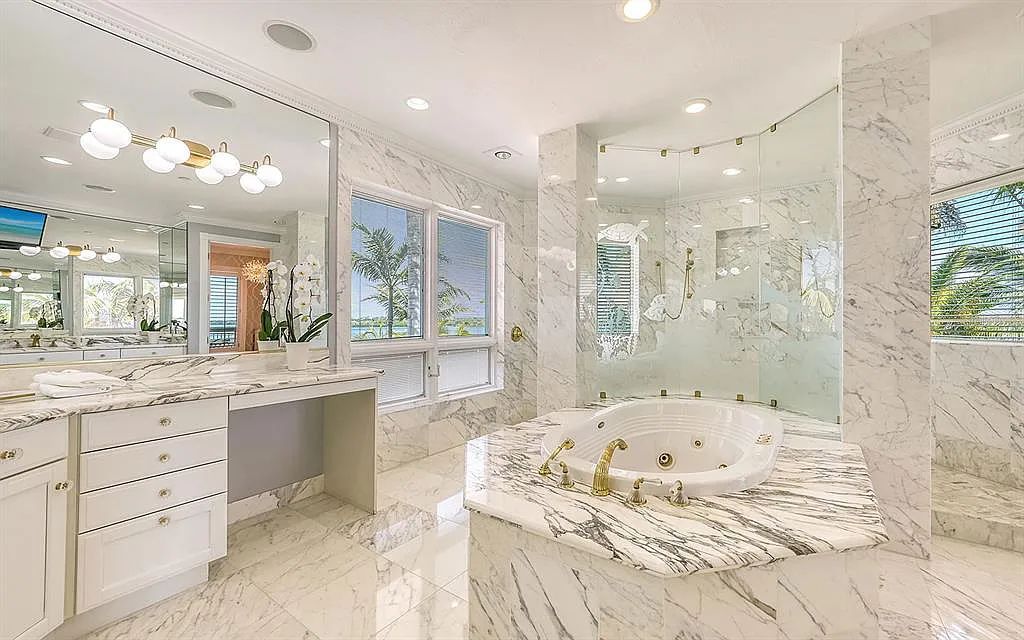 Welcome to a stunning Siesta Key coastal home 1414 Point Crisp Road, Sarasota, Florida with 360-degree bay views and 546 feet of waterfront on Little Sarasota Bay. This 6-bed, 9-bath home boasts 7,162 sqft of living space on 1.22 acres of land.