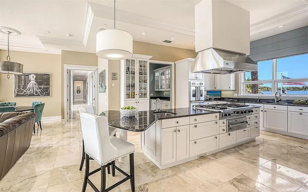Welcome to a stunning Siesta Key coastal home 1414 Point Crisp Road, Sarasota, Florida with 360-degree bay views and 546 feet of waterfront on Little Sarasota Bay. This 6-bed, 9-bath home boasts 7,162 sqft of living space on 1.22 acres of land.