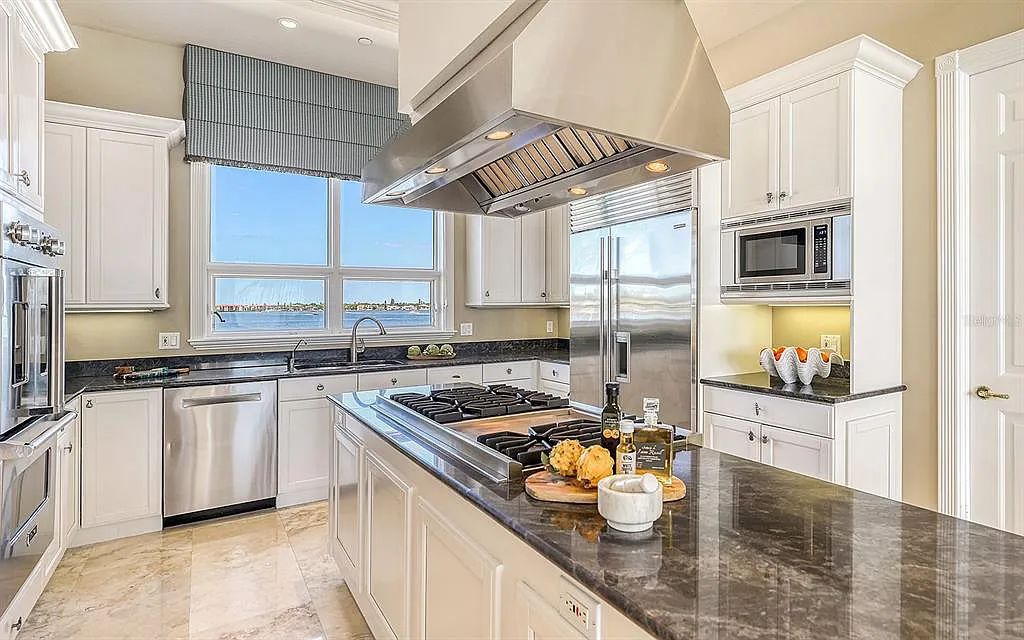 Welcome to a stunning Siesta Key coastal home 1414 Point Crisp Road, Sarasota, Florida with 360-degree bay views and 546 feet of waterfront on Little Sarasota Bay. This 6-bed, 9-bath home boasts 7,162 sqft of living space on 1.22 acres of land.