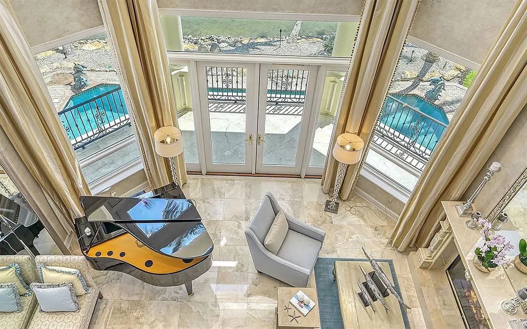 Welcome to a stunning Siesta Key coastal home 1414 Point Crisp Road, Sarasota, Florida with 360-degree bay views and 546 feet of waterfront on Little Sarasota Bay. This 6-bed, 9-bath home boasts 7,162 sqft of living space on 1.22 acres of land.
