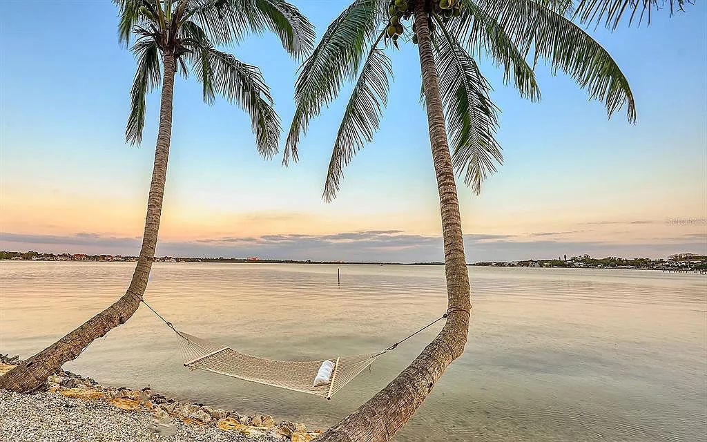 Welcome to a stunning Siesta Key coastal home 1414 Point Crisp Road, Sarasota, Florida with 360-degree bay views and 546 feet of waterfront on Little Sarasota Bay. This 6-bed, 9-bath home boasts 7,162 sqft of living space on 1.22 acres of land.