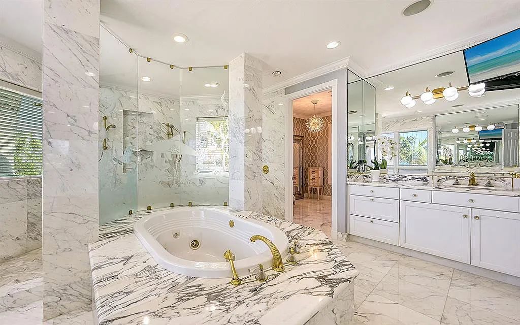 Welcome to a stunning Siesta Key coastal home 1414 Point Crisp Road, Sarasota, Florida with 360-degree bay views and 546 feet of waterfront on Little Sarasota Bay. This 6-bed, 9-bath home boasts 7,162 sqft of living space on 1.22 acres of land.