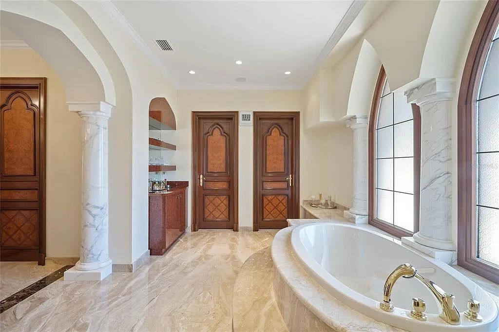 Discover the ultimate in luxury living at 4852 S Peninsula Drive in Ponce Inlet, Florida. This privately gated 3-acre waterfront estate boasts 6 bedrooms, 9 bathrooms, 12,126 sq ft of living space, and a 2.80-acre lot size built in 2004.