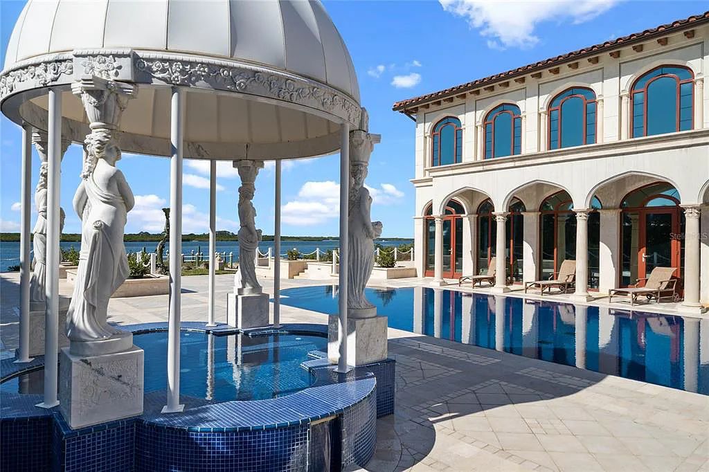 Discover the ultimate in luxury living at 4852 S Peninsula Drive in Ponce Inlet, Florida. This privately gated 3-acre waterfront estate boasts 6 bedrooms, 9 bathrooms, 12,126 sq ft of living space, and a 2.80-acre lot size built in 2004.