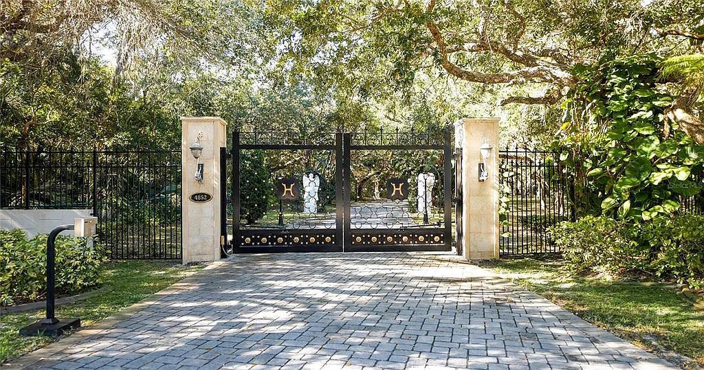 Discover the ultimate in luxury living at 4852 S Peninsula Drive in Ponce Inlet, Florida. This privately gated 3-acre waterfront estate boasts 6 bedrooms, 9 bathrooms, 12,126 sq ft of living space, and a 2.80-acre lot size built in 2004.