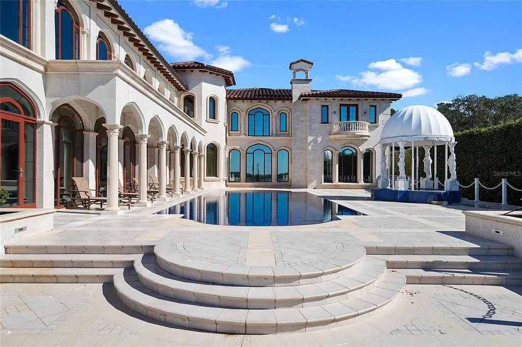 Discover the ultimate in luxury living at 4852 S Peninsula Drive in Ponce Inlet, Florida. This privately gated 3-acre waterfront estate boasts 6 bedrooms, 9 bathrooms, 12,126 sq ft of living space, and a 2.80-acre lot size built in 2004.