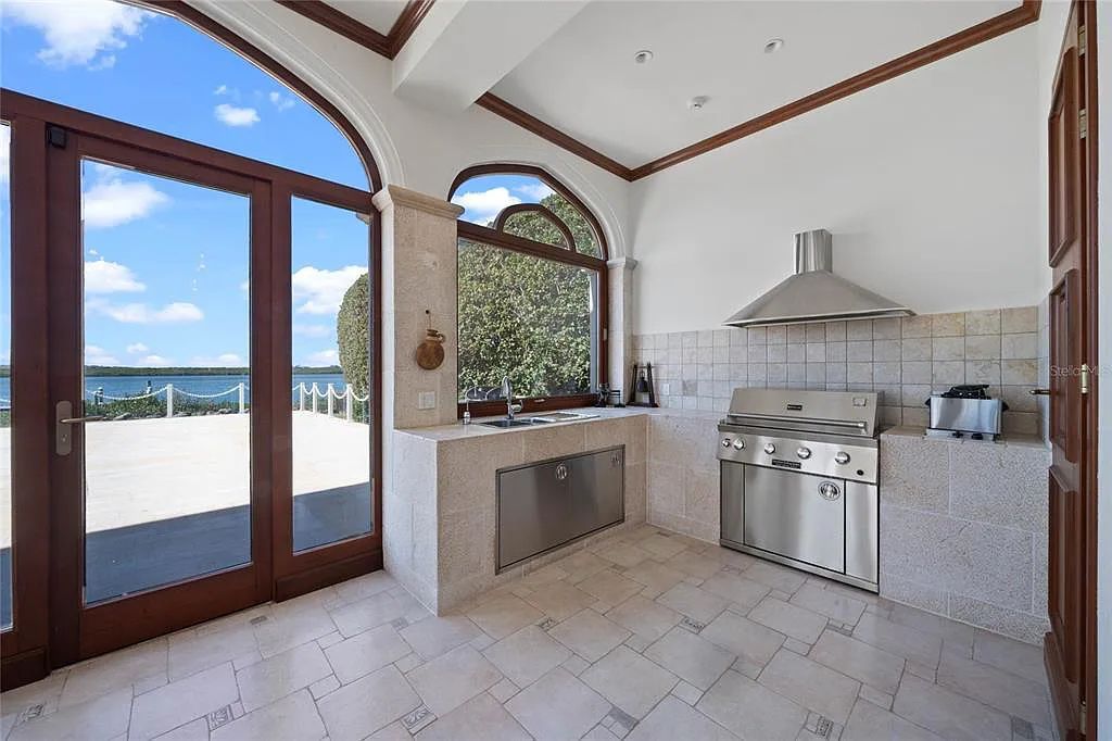 Discover the ultimate in luxury living at 4852 S Peninsula Drive in Ponce Inlet, Florida. This privately gated 3-acre waterfront estate boasts 6 bedrooms, 9 bathrooms, 12,126 sq ft of living space, and a 2.80-acre lot size built in 2004.