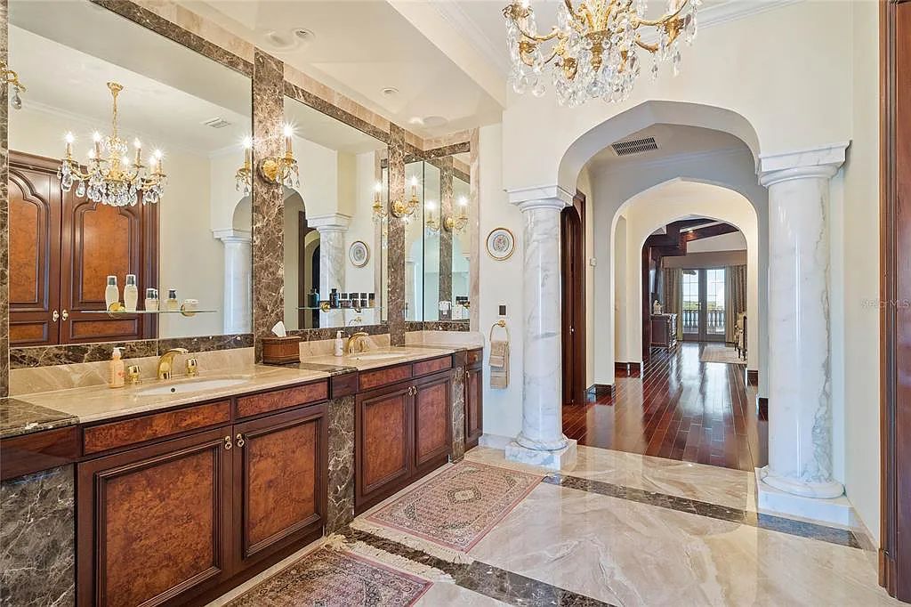 Discover the ultimate in luxury living at 4852 S Peninsula Drive in Ponce Inlet, Florida. This privately gated 3-acre waterfront estate boasts 6 bedrooms, 9 bathrooms, 12,126 sq ft of living space, and a 2.80-acre lot size built in 2004.