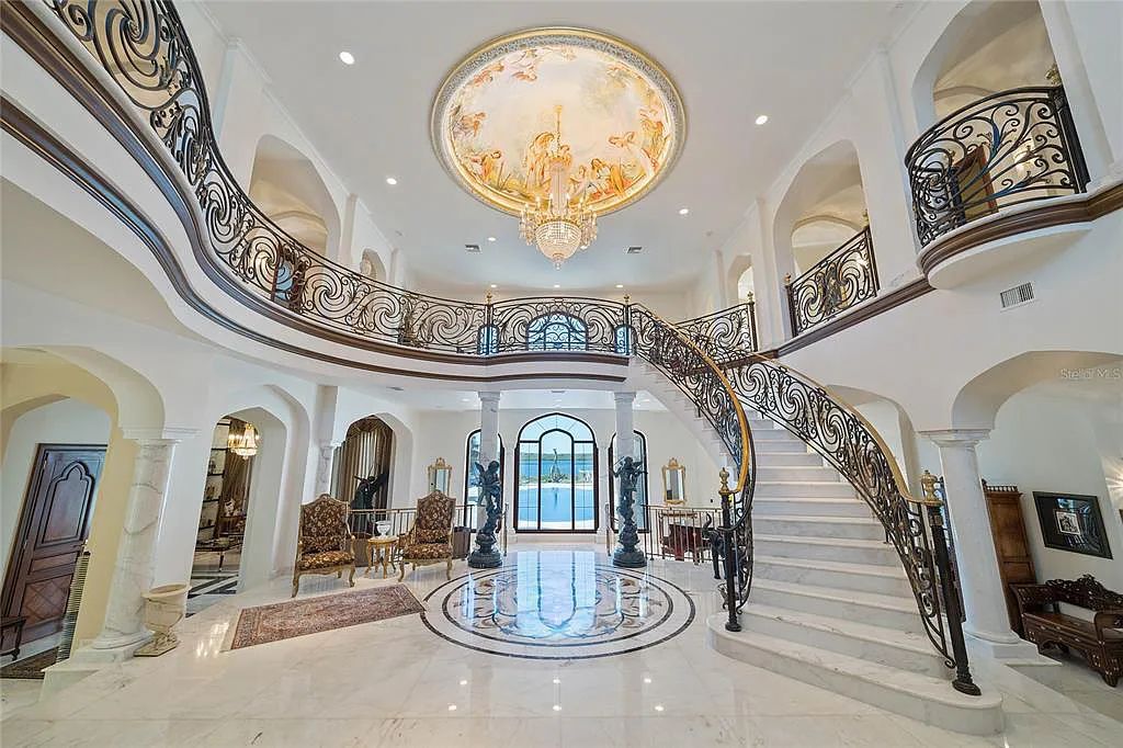 Discover the ultimate in luxury living at 4852 S Peninsula Drive in Ponce Inlet, Florida. This privately gated 3-acre waterfront estate boasts 6 bedrooms, 9 bathrooms, 12,126 sq ft of living space, and a 2.80-acre lot size built in 2004.