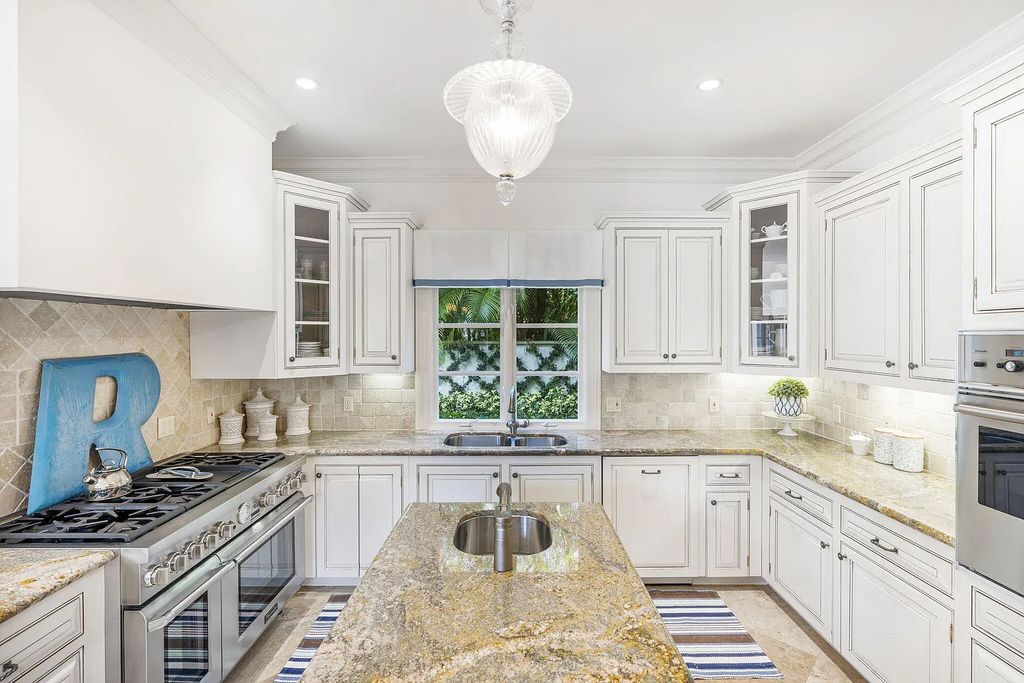 Experience luxury living at its finest in Palm Beach, Florida with this stunning Mediterranean estate on 224 Barton Avenue. The fully furnished home features 4 bedrooms, 5 bathrooms, and over 6,387 sqft of living space, complete with a custom gourmet kitchen and butler's pantry.