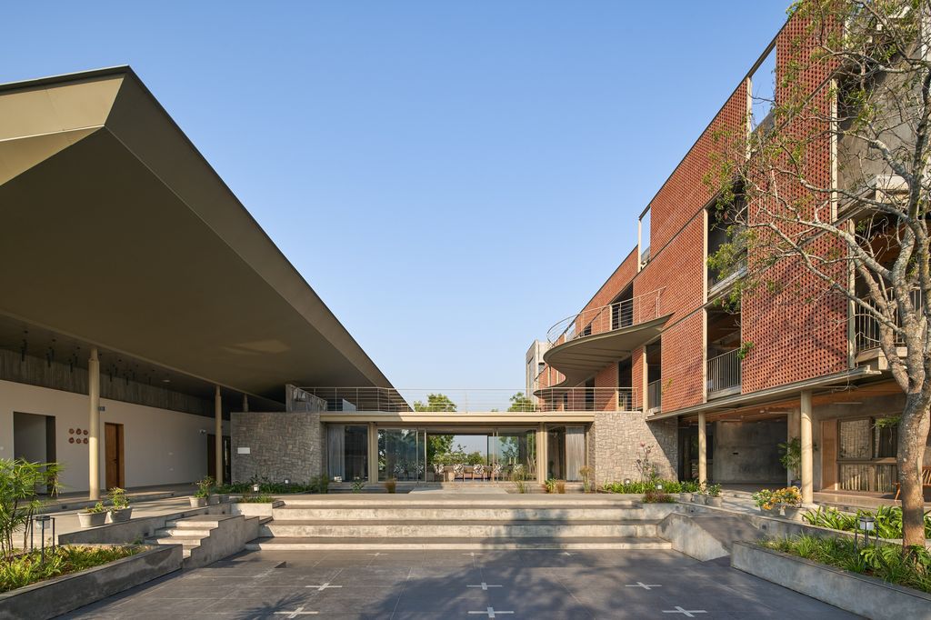 Athachi Farmhouse with Raw, Earthy Tone Exterior by Alchemy Architects