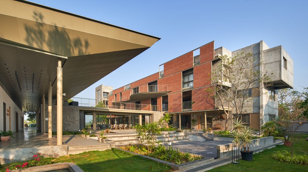Athachi Farmhouse with Raw, Earthy Tone Exterior by Alchemy Architects