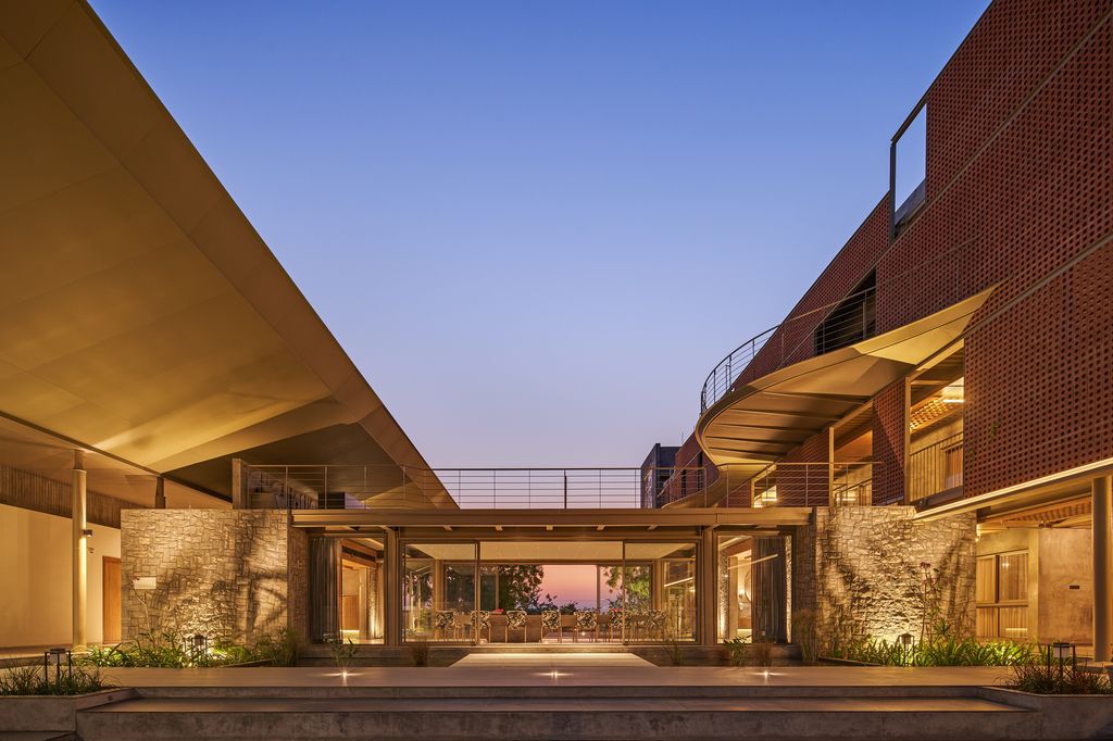 Athachi Farmhouse with Raw, Earthy Tone Exterior by Alchemy Architects