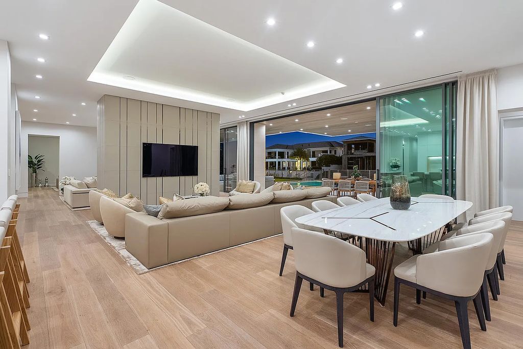 Discover this awe-inspiring waterfront estate at 224 W Key Palm Road, Boca Raton, Florida. Built in 2023 by Sarkela Corp and Ada Architecture Design Atelier, this luxurious property boasts 6 opulent bedrooms, 7 full and 2 half baths, and over 9,500 sq ft of palatial living space.