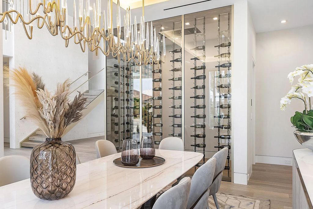 Discover this awe-inspiring waterfront estate at 224 W Key Palm Road, Boca Raton, Florida. Built in 2023 by Sarkela Corp and Ada Architecture Design Atelier, this luxurious property boasts 6 opulent bedrooms, 7 full and 2 half baths, and over 9,500 sq ft of palatial living space.