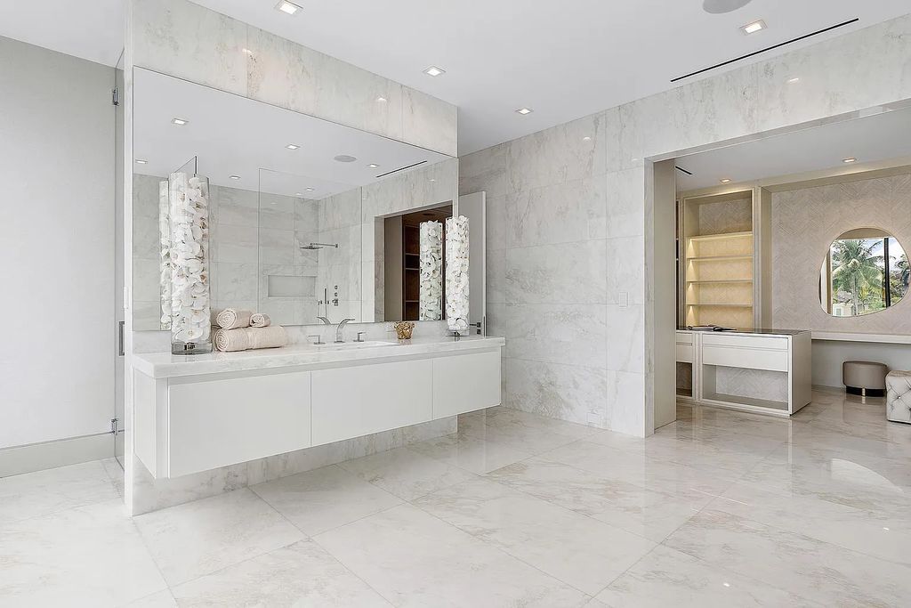 Discover this awe-inspiring waterfront estate at 224 W Key Palm Road, Boca Raton, Florida. Built in 2023 by Sarkela Corp and Ada Architecture Design Atelier, this luxurious property boasts 6 opulent bedrooms, 7 full and 2 half baths, and over 9,500 sq ft of palatial living space.