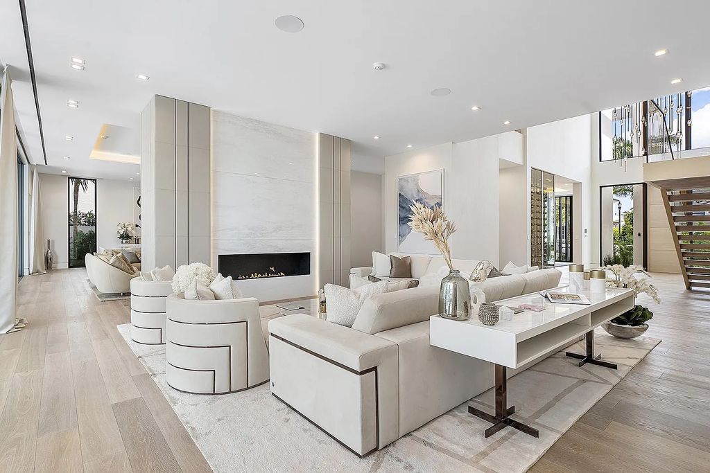Discover this awe-inspiring waterfront estate at 224 W Key Palm Road, Boca Raton, Florida. Built in 2023 by Sarkela Corp and Ada Architecture Design Atelier, this luxurious property boasts 6 opulent bedrooms, 7 full and 2 half baths, and over 9,500 sq ft of palatial living space.