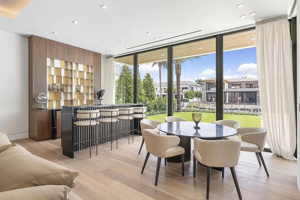 Discover this awe-inspiring waterfront estate at 224 W Key Palm Road, Boca Raton, Florida. Built in 2023 by Sarkela Corp and Ada Architecture Design Atelier, this luxurious property boasts 6 opulent bedrooms, 7 full and 2 half baths, and over 9,500 sq ft of palatial living space.
