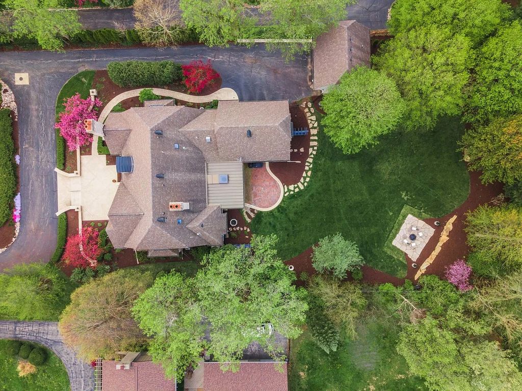 Breathtaking Story Stone Home with Exceptional Landscaping in Bloomington, IL - Priced at $2.249M