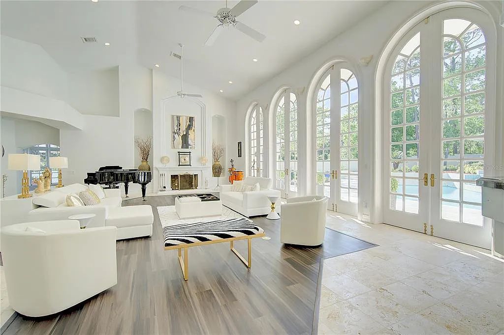 Discover the stunning 6-bed, 8-bath estate at 400 Saddleworth Place in Lake Mary, Florida. Situated on 2.82 acres within Heathrow's premier community, this custom-built home offers over 9,000 sqft of luxurious living space.