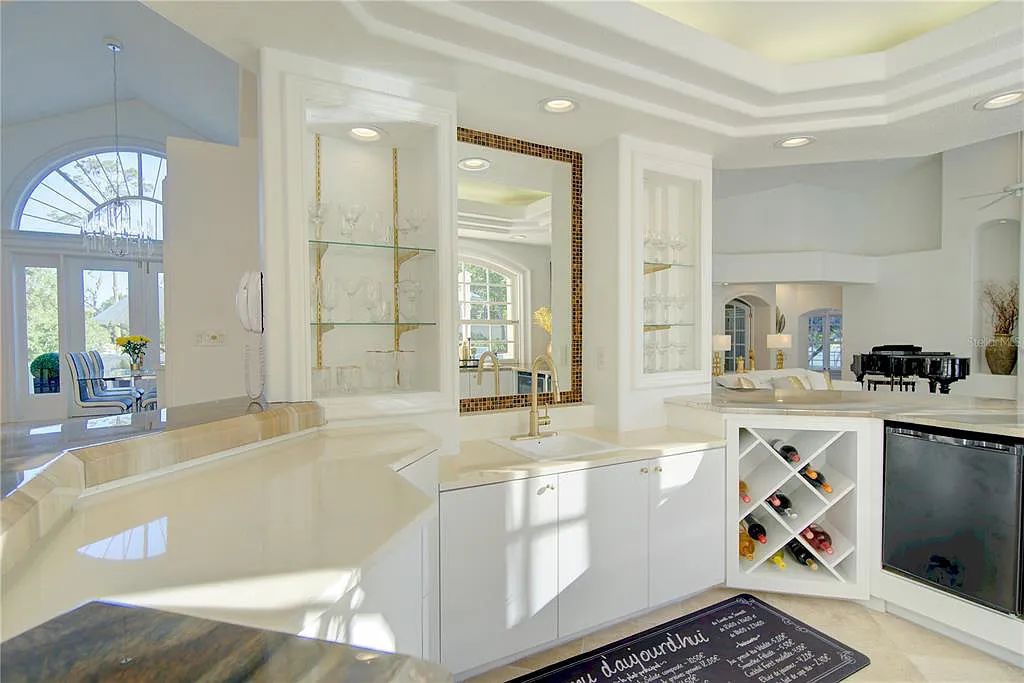 Discover the stunning 6-bed, 8-bath estate at 400 Saddleworth Place in Lake Mary, Florida. Situated on 2.82 acres within Heathrow's premier community, this custom-built home offers over 9,000 sqft of luxurious living space.