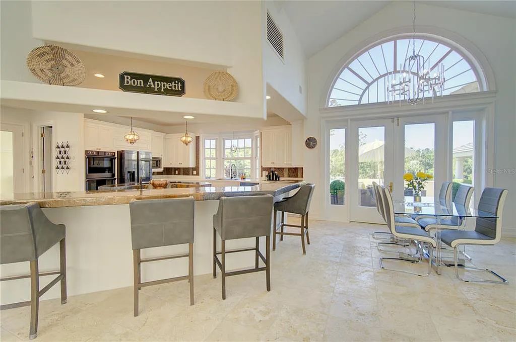 Discover the stunning 6-bed, 8-bath estate at 400 Saddleworth Place in Lake Mary, Florida. Situated on 2.82 acres within Heathrow's premier community, this custom-built home offers over 9,000 sqft of luxurious living space.