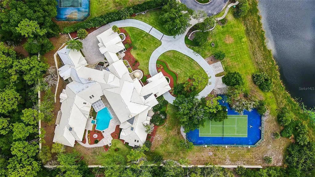 Discover the stunning 6-bed, 8-bath estate at 400 Saddleworth Place in Lake Mary, Florida. Situated on 2.82 acres within Heathrow's premier community, this custom-built home offers over 9,000 sqft of luxurious living space.