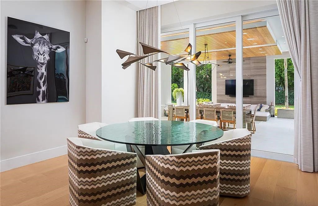 146 Myrtle Road, Naples, Florida newly completed, custom contemporary Pine Ridge estate boasts 6 beds, 10 baths, 7,238 sq ft of living space on a 1.21-acre lot.